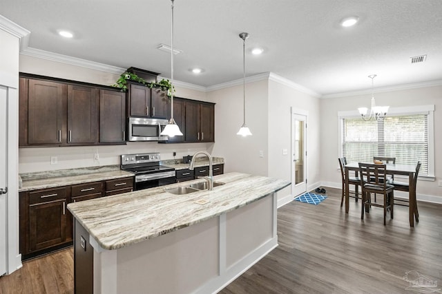 kitchen with dark brown cabinetry, dark wood-type flooring, a sink, appliances with stainless steel finishes, and crown molding