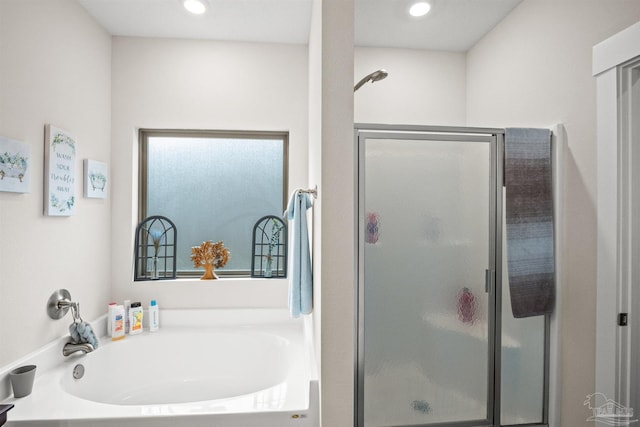 full bath featuring a garden tub, a shower stall, and recessed lighting