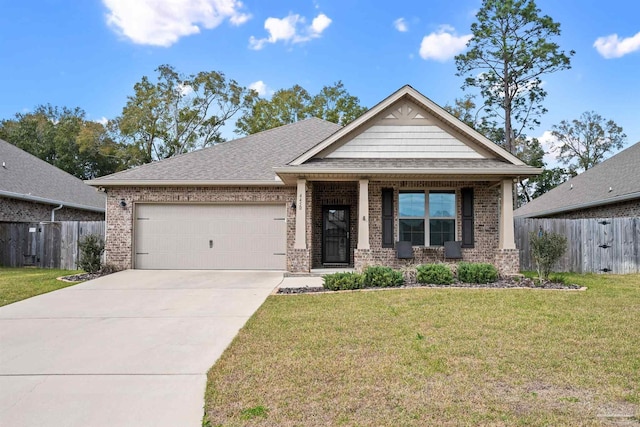 craftsman inspired home with concrete driveway, an attached garage, fence, a front yard, and brick siding