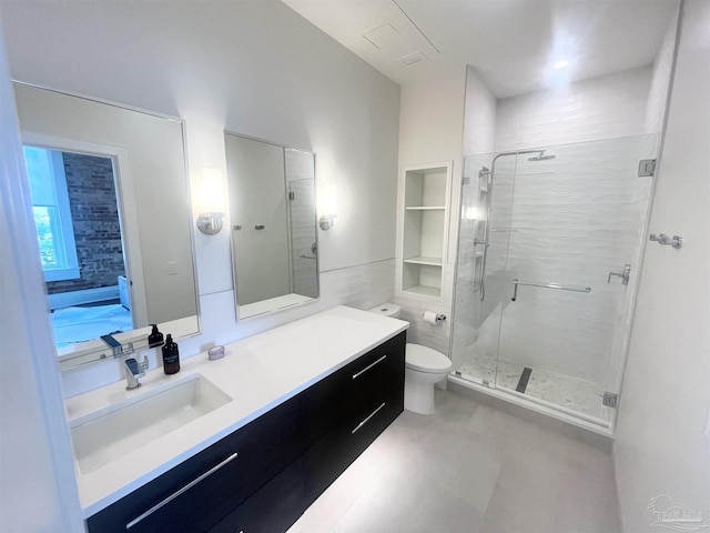 full bathroom with toilet, a shower stall, and vanity