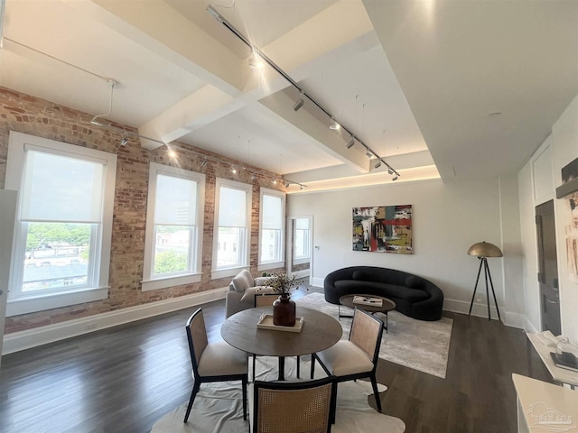 dining space featuring brick wall, baseboards, and dark wood-style flooring