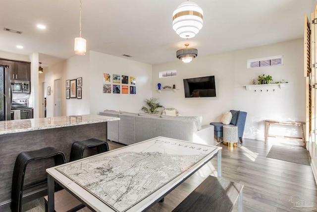 dining room featuring light hardwood / wood-style flooring