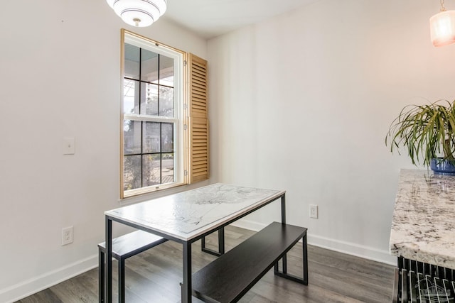 dining space featuring dark hardwood / wood-style flooring