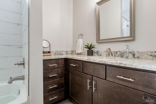 bathroom with shower / bathing tub combination and vanity