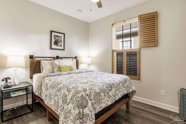 bedroom featuring ceiling fan and dark hardwood / wood-style flooring