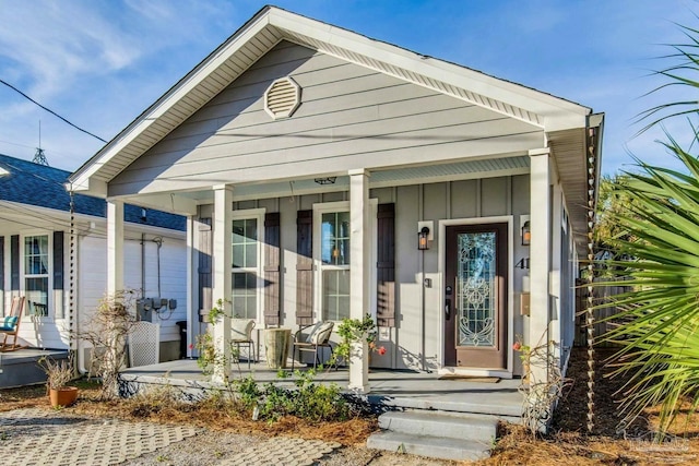 property entrance with covered porch