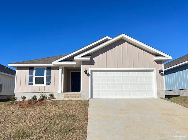 ranch-style house with concrete driveway, board and batten siding, and an attached garage