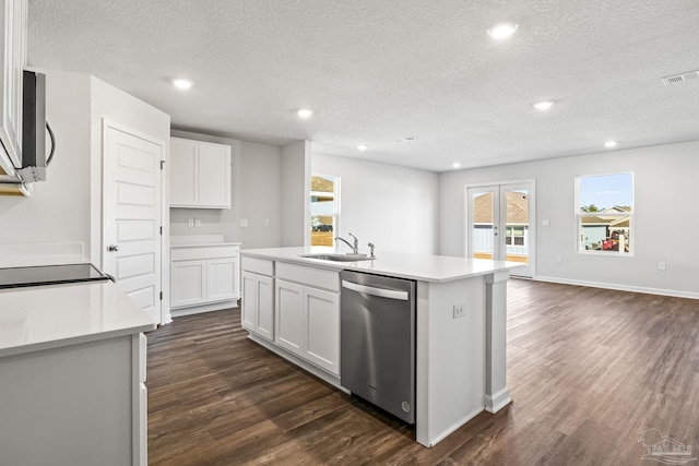 kitchen featuring a textured ceiling, dark wood-style flooring, a sink, and stainless steel appliances