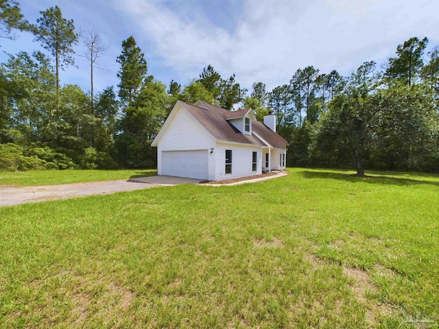 view of property exterior with a garage and a yard