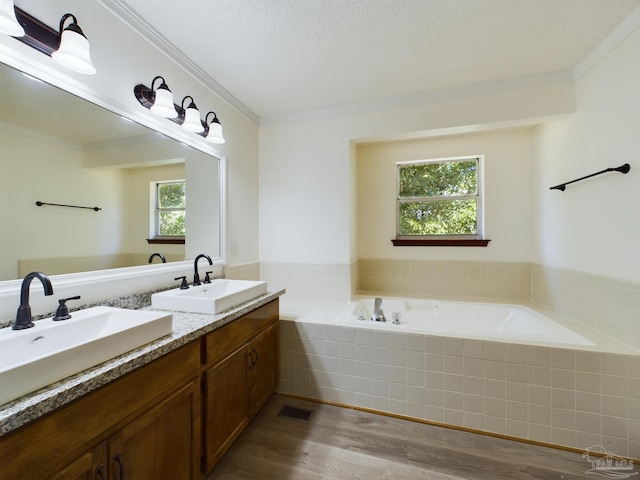 bathroom featuring vanity, crown molding, a textured ceiling, and hardwood / wood-style flooring