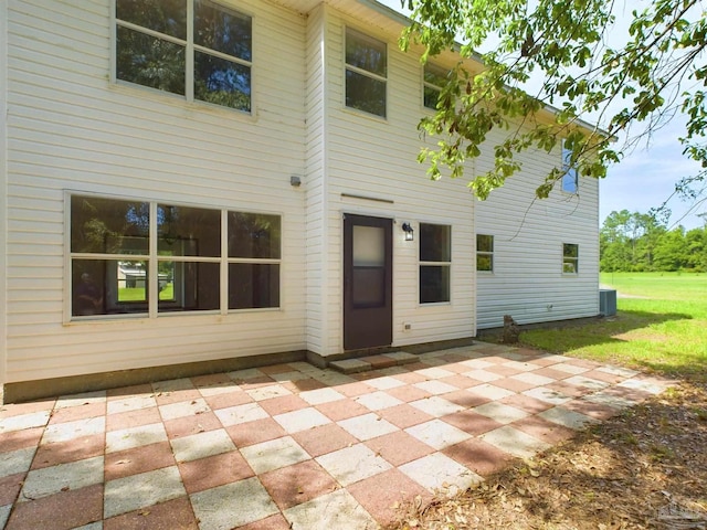 back of house with central AC and a patio area