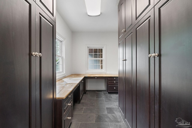 bathroom featuring stone finish flooring