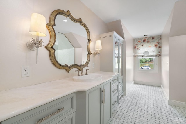 bathroom with baseboards and vanity
