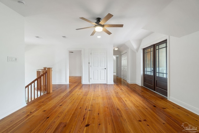 interior space featuring a ceiling fan, visible vents, baseboards, recessed lighting, and hardwood / wood-style floors
