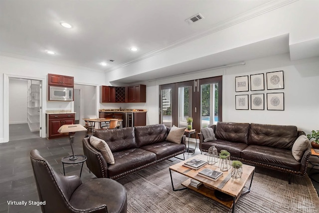 living area with crown molding, recessed lighting, and visible vents