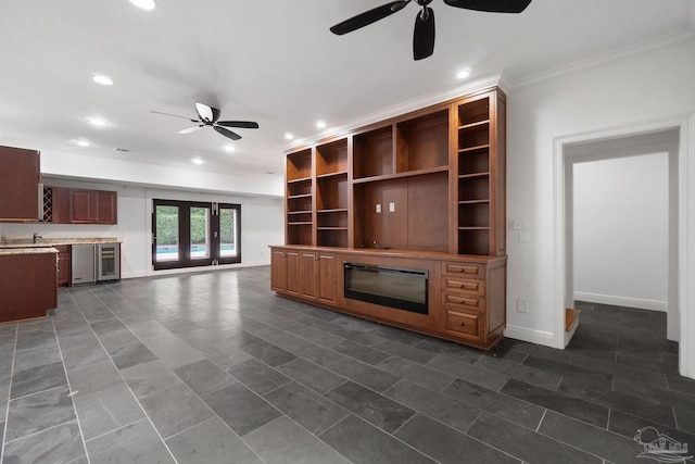 unfurnished living room with crown molding, a ceiling fan, wine cooler, and recessed lighting