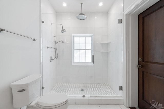 full bathroom with recessed lighting, a stall shower, and toilet