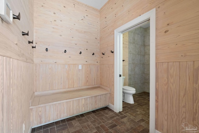 mudroom featuring brick patterned floor