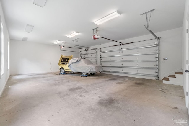 garage featuring a garage door opener