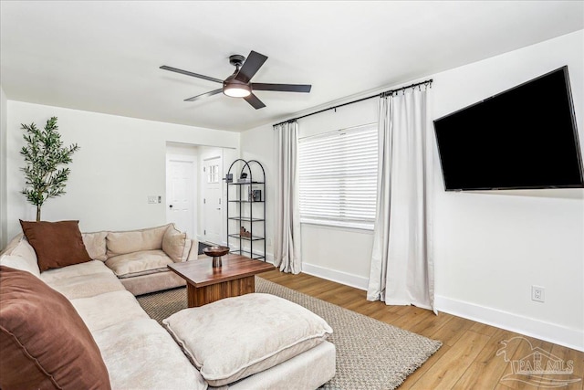 2707 E De Soto St, Pensacola, FL 32503 - living area featuring light wood-style flooring, baseboards, and a ceiling fan