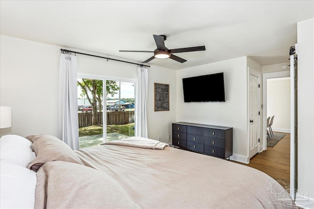 2707 E De Soto St, Pensacola, FL 32503 - bedroom with ceiling fan, wood finished floors, baseboards, and access to exterior