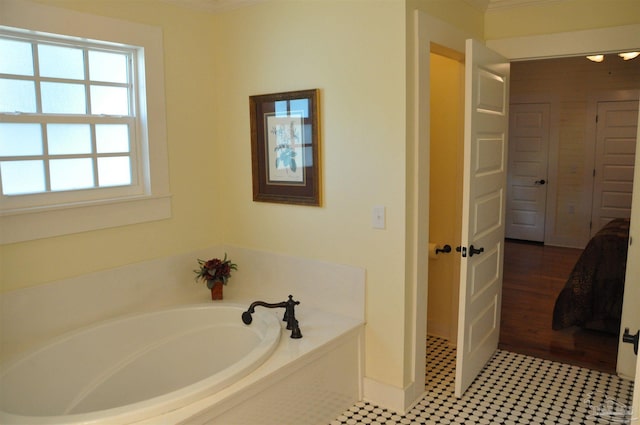 4565 Forsyth St, Bagdad, FL 32583 - full bath featuring a garden tub, baseboards, and ornamental molding