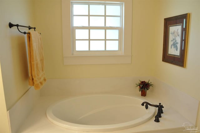 4565 Forsyth St, Bagdad, FL 32583 - bathroom featuring a bath and plenty of natural light