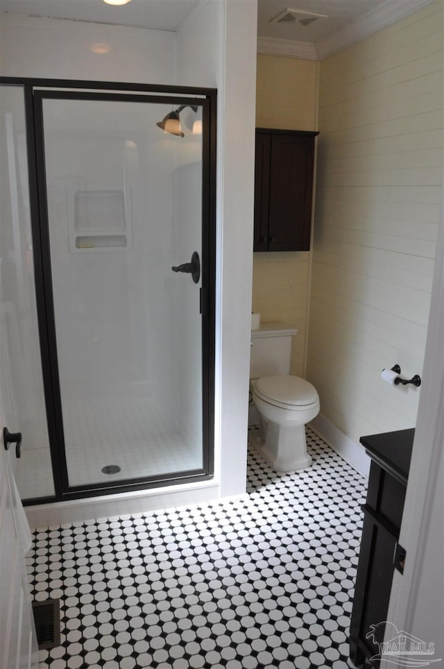 4565 Forsyth St, Bagdad, FL 32583 - bathroom with a shower stall, crown molding, toilet, vanity, and tile patterned floors