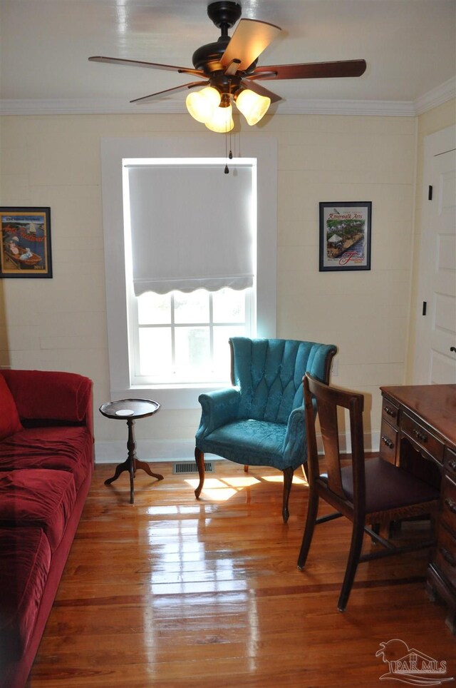 4565 Forsyth St, Bagdad, FL 32583 - living area featuring ornamental molding, ceiling fan, and wood finished floors