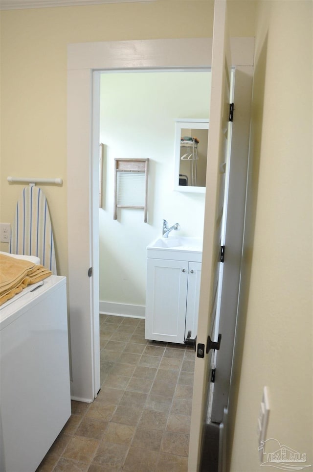 4565 Forsyth St, Bagdad, FL 32583 - washroom with a sink, baseboards, and stone finish flooring
