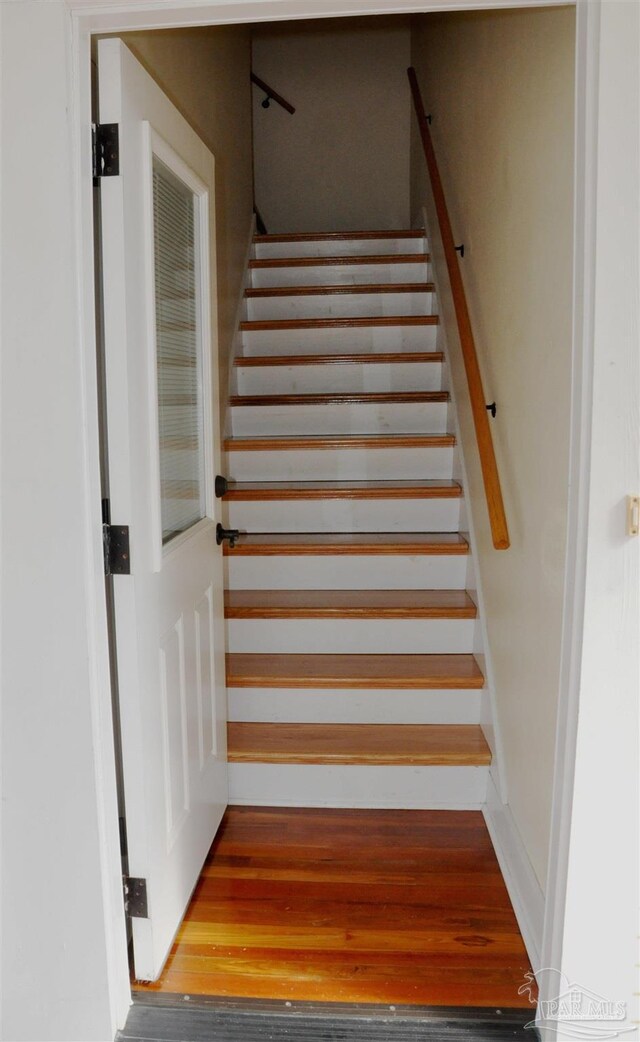 4565 Forsyth St, Bagdad, FL 32583 - stairway with wood finished floors
