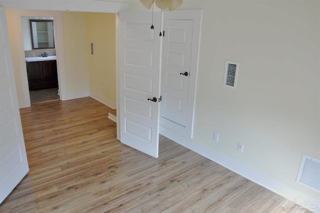 4565 Forsyth St, Bagdad, FL 32583 - unfurnished room featuring light wood-style floors and baseboards