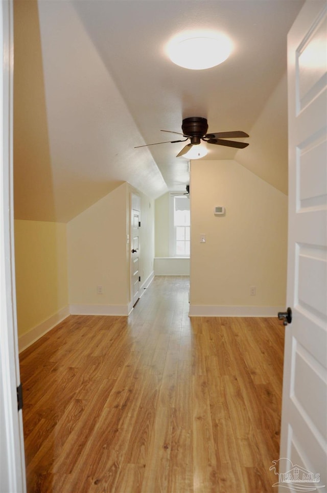4565 Forsyth St, Bagdad, FL 32583 - bonus room with ceiling fan, light wood finished floors, lofted ceiling, and baseboards