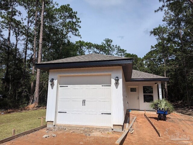 garage with a lawn