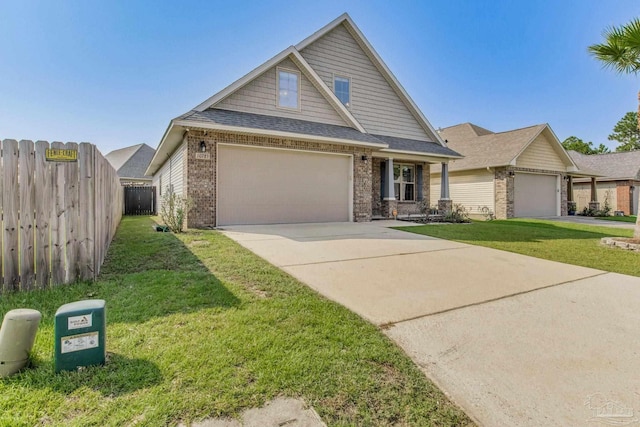 view of front of property with a garage and a front yard