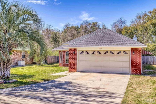 view of front of home featuring brick siding, a front lawn, and fence