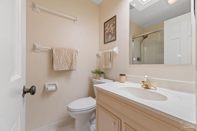 bathroom featuring tile patterned floors, vanity, toilet, and a shower with shower door