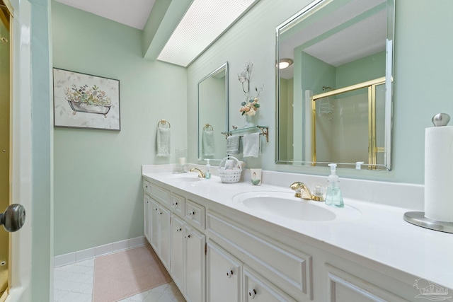 bathroom with tile patterned flooring, vanity, and an enclosed shower