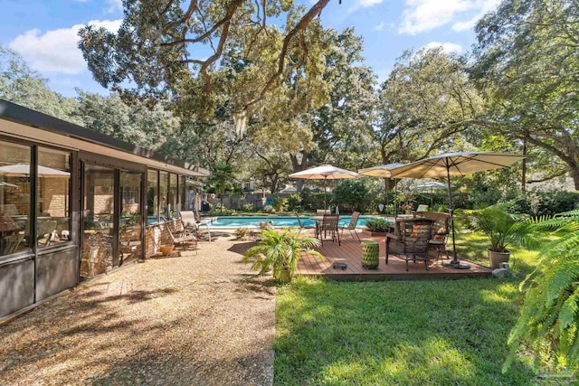 view of yard with a fenced in pool