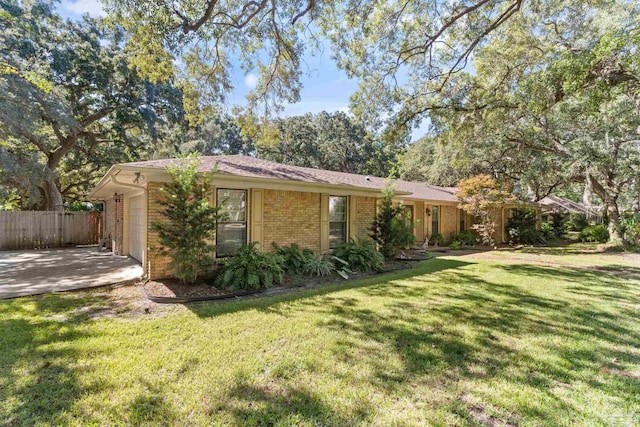 exterior space with a garage and a yard