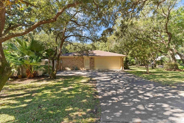 view of front of house featuring a front yard and a garage