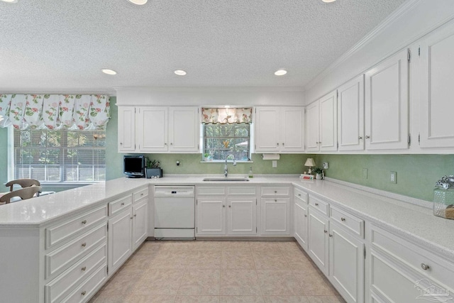 kitchen featuring dishwasher, white cabinetry, kitchen peninsula, and sink