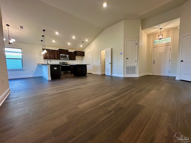 kitchen featuring pendant lighting, a notable chandelier, dark hardwood / wood-style floors, dark brown cabinets, and stainless steel appliances