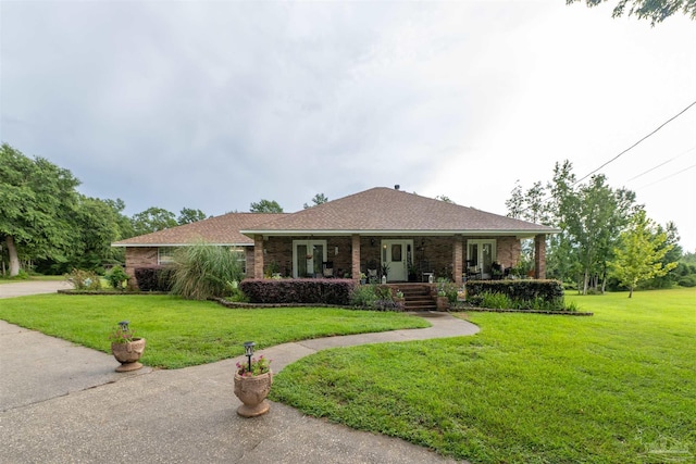 ranch-style home with a porch and a front yard