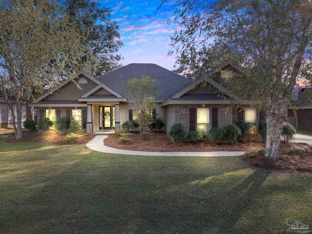 craftsman-style house with a lawn