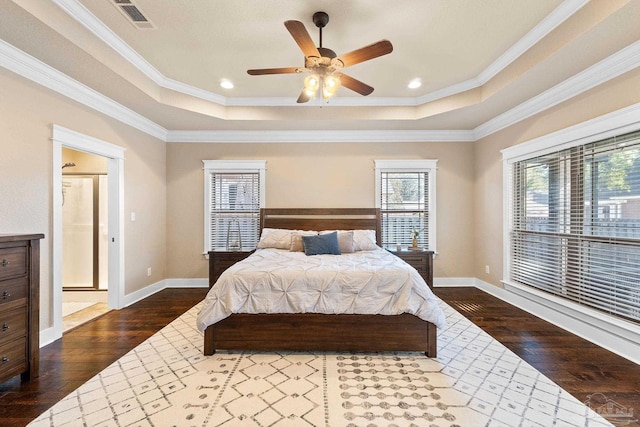 bedroom featuring a tray ceiling, crown molding, ceiling fan, and dark hardwood / wood-style floors