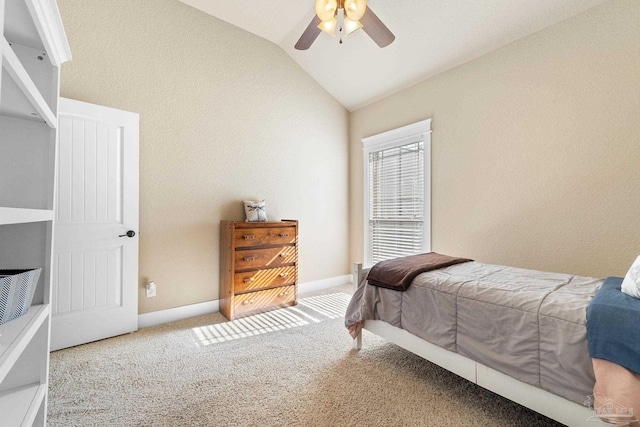 bedroom with carpet floors, vaulted ceiling, and ceiling fan