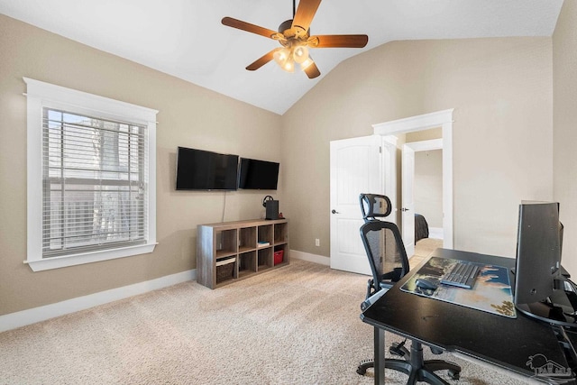 home office featuring light colored carpet, ceiling fan, and lofted ceiling