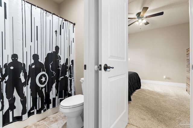 bathroom featuring tile patterned floors, toilet, and ceiling fan