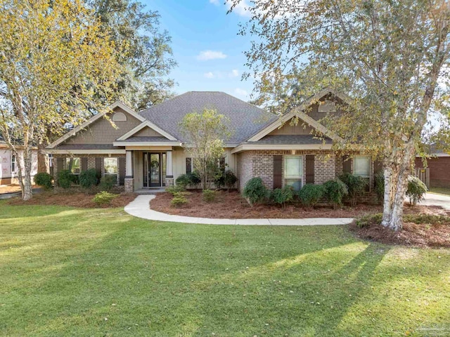 craftsman-style home featuring a front lawn